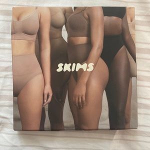 Brand new, never been worn black Skims Core Control Thong